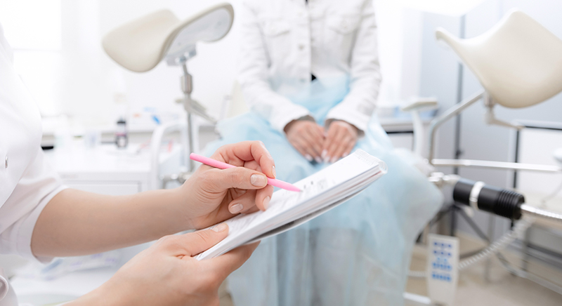 Woman speaking with a gynaecologist during a consultation to discuss abortion surgery